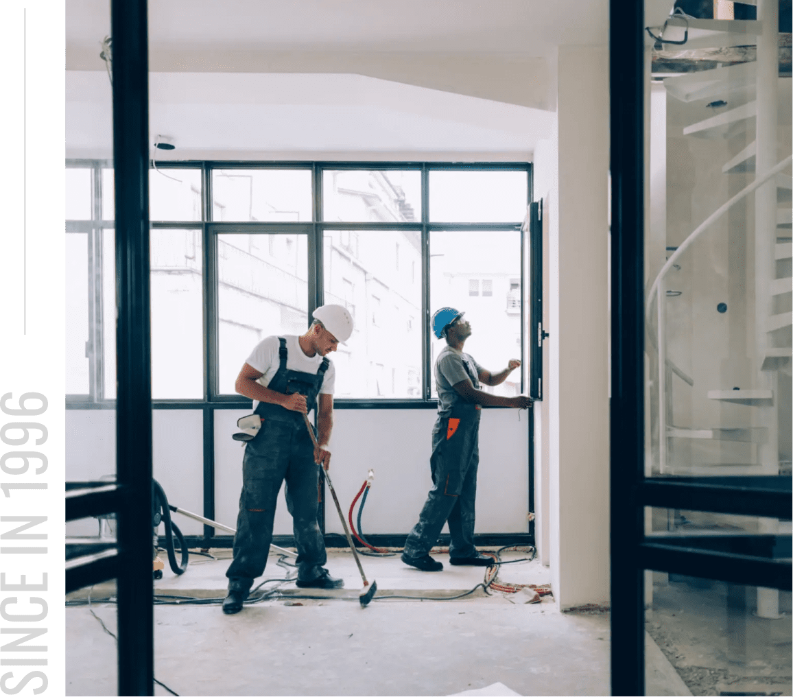Construction workers renovating a room