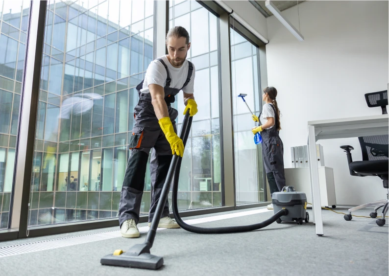 Cleaning staff vacuuming and washing windows
