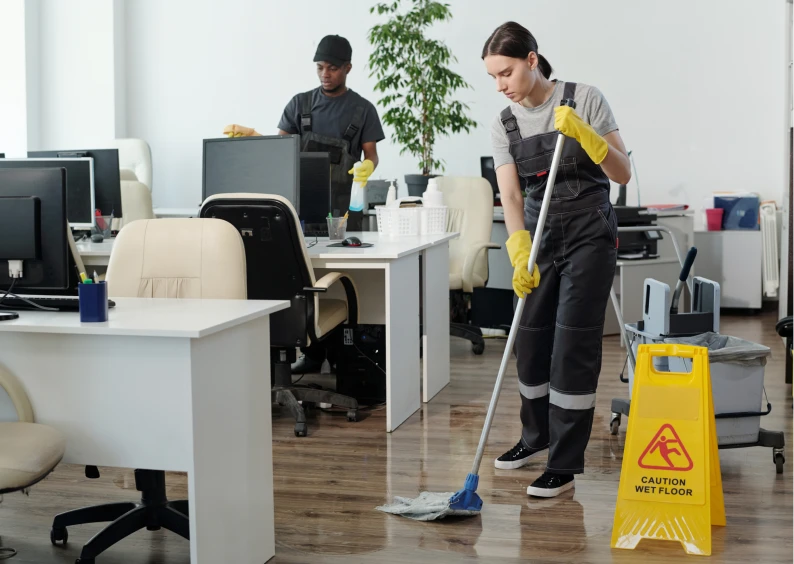 Janitors maintaining cleanliness in workplace